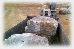 Huge Random grade sandstone boulders begin transported to the Gold Coast for the construction of a Massive sea wall which was further landscaped using tumbled sandstone delivered and supplied by Rock Supply Brisbane from their select grade sandstone quarries located on the Queensland Sunshine Coast