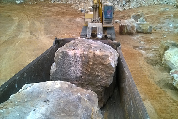 Huge Random Sandstone Boulders Being Loaded